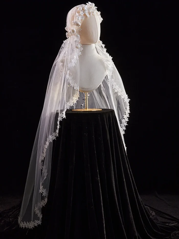 The Elsie Cap, a cream white juliet cap veil with 3D fabric flowers, pearls and a lace-edged tulle veil