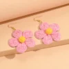 Seba0ad3e8c04404680e617f24a2c7300h.webp Textured Hand-Woven Raffia Bloom Earrings