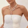 Sebe5d2e94a6b46b3926c928d713a0b42d.webp Eternal Radiance Layered Pearl Necklace with Cross Pendant