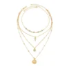 Sf0382cb055f14874a0aca05ebe6fc3f0q.webp Elements Lost and Found Gold Layered Necklace with Turquoise Details