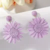 Sf3214cc966d340a58e809269720be470d-1.webp Mediterranean Bloom Raffia Flower Dangle Earrings