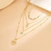 Sf38cad1d25c947a99c30312ecc4f35b35.webp Elements Lost and Found Gold Layered Necklace with Turquoise Details