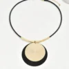 Sf5b93775aff042049400393c79e28a169.webp Dynamic Circular Necklace with Textured Gold and Black Pendant
