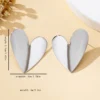 Sfb2cdd2e237a41818e400ddda5ca8248V.webp Sculpted Heart Statement Earrings