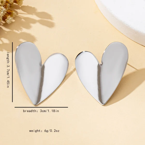Sfb2cdd2e237a41818e400ddda5ca8248V.webp Sculpted Heart Statement Earrings