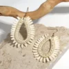 Sfd59100b11444d97a998b19c0faa3904M.webp Assorted sculptural raffia earrings in natural ivory