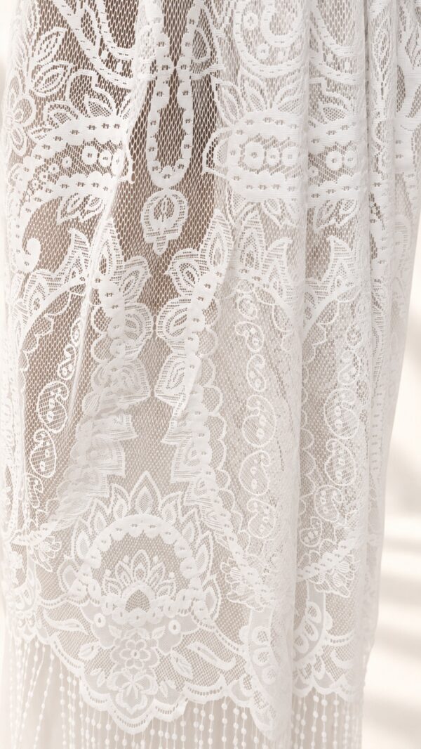 The Alba Veil, an ivory tassel fringe wedding veil in floral lace with a scalloped border