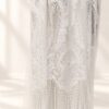 The Alba Veil, an ivory tassel fringe wedding veil in floral lace with a scalloped border