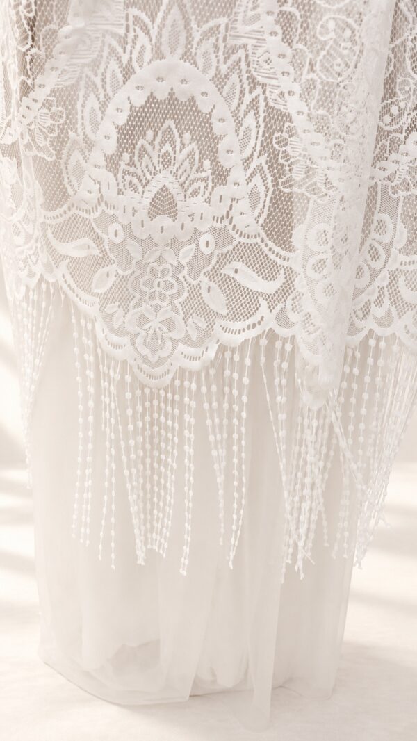 The Alba Veil, an ivory tassel fringe wedding veil in floral lace with a scalloped border