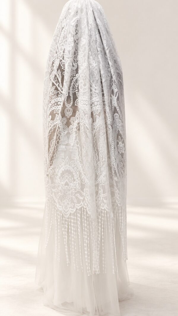 The Alba Veil, an ivory tassel fringe wedding veil in floral lace with a scalloped border