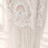 The Alba Veil, an ivory tassel fringe wedding veil in floral lace with a scalloped border