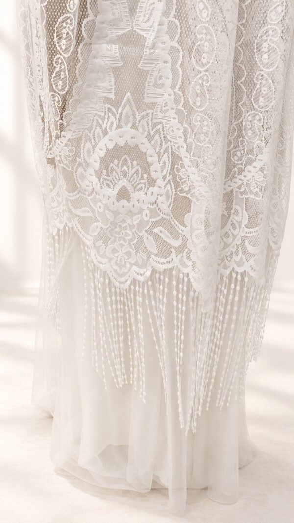The Alba Veil, an ivory tassel fringe wedding veil in floral lace with a scalloped border