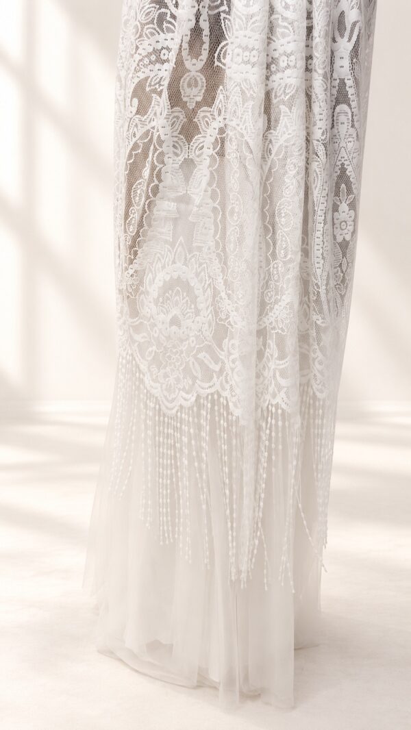 The Alba Veil, an ivory tassel fringe wedding veil in floral lace with a scalloped border