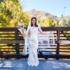 The Alba Veil, an ivory tassel fringe wedding veil in floral lace with a scalloped border