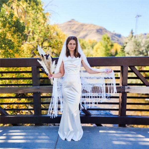 The Alba Veil, an ivory tassel fringe wedding veil in floral lace with a scalloped border