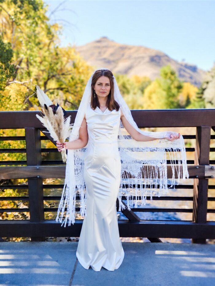 The Alba Veil, an ivory tassel fringe wedding veil in floral lace with a scalloped border