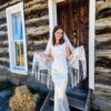 The Alba Veil, an ivory tassel fringe wedding veil in floral lace with a scalloped border