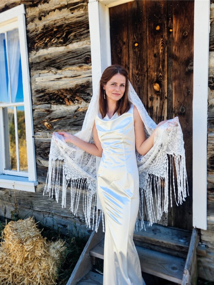 The Alba Veil, an ivory tassel fringe wedding veil in floral lace with a scalloped border