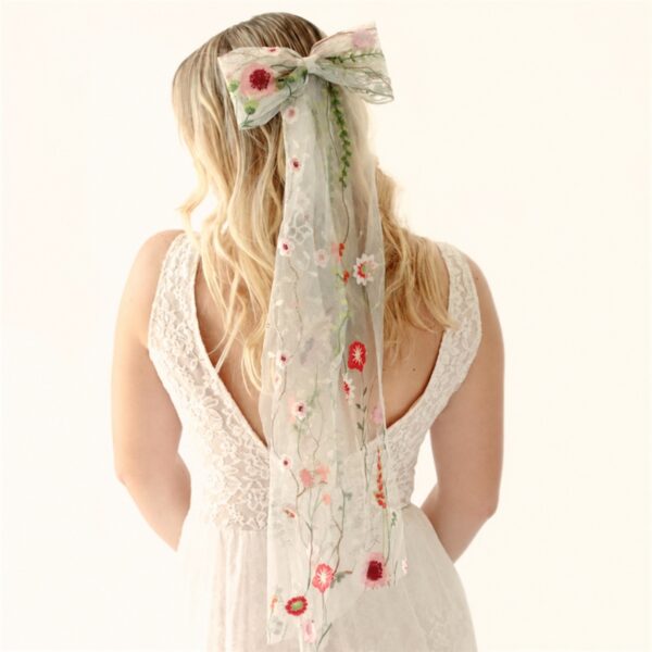 photo_1792489407_7066 The Poppy Bow, a wildflower embroidered wedding hair bow with veil tails on a comb