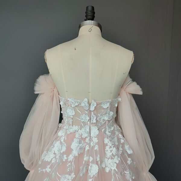 ai-edited-1772918919281-4 Romantic Pink Embroidered Bridal Gown with Floral Accents