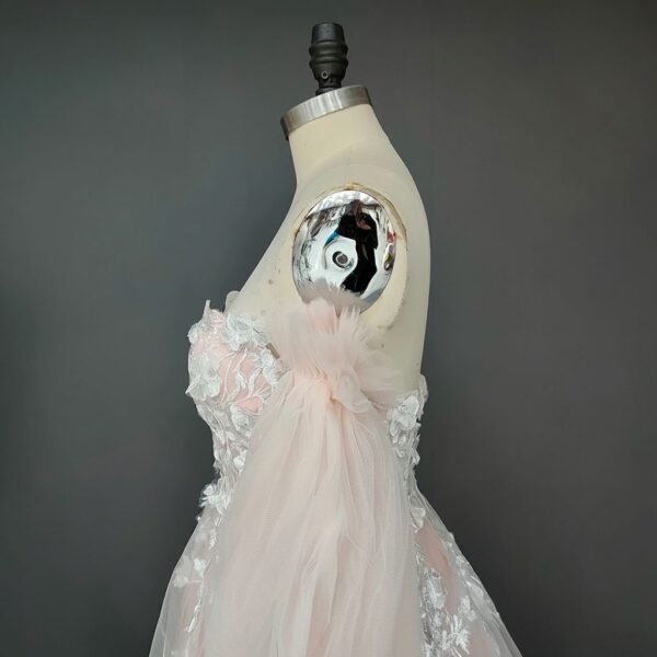 ai-edited-1772918921375-5 Romantic Pink Embroidered Bridal Gown with Floral Accents