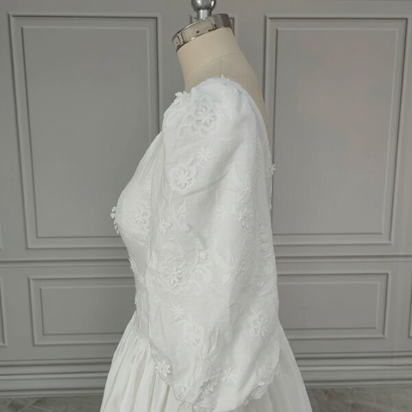 ai-edited-1776599946704-10 Vintage Broderie Anglaise Wedding Dress with Tiered Eyelet Lace Skirt