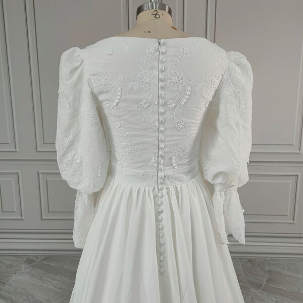 ai-edited-1776599952409-15 Vintage Broderie Anglaise Wedding Dress with Tiered Eyelet Lace Skirt