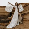 Full-length front view of boho lace wedding dress with split bell sleeves and front slit