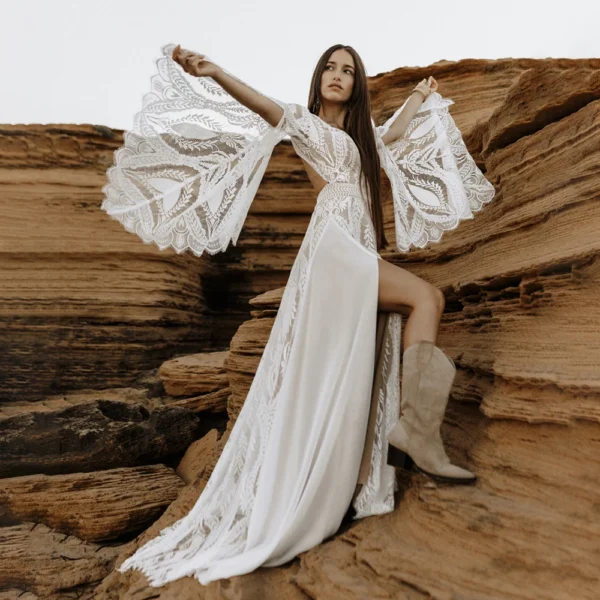 Full-length front view of boho lace wedding dress with split bell sleeves and front slit
