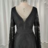Close front view of black long-sleeve lace wedding dress