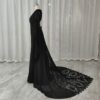 Side view of black lace wedding gown with long train
