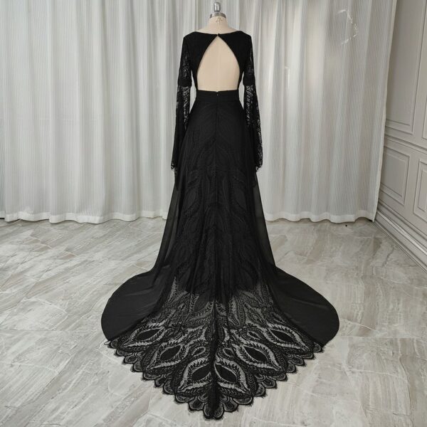 Rear view of black open-back lace gown with patterned train