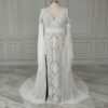 Full-length off-white bohemian lace wedding dress in studio