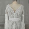 Close front view of deep V-neck and intricate lace bodice