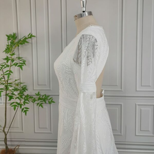 Side view of backless off-white lace maxi wedding dress