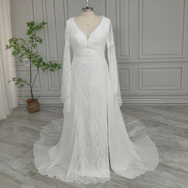 Off-white lace wedding gown with bell sleeves and flowing skirt