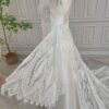 Lace bell sleeve displayed beside off-white boho wedding dress