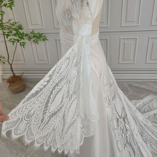 Lace bell sleeve displayed beside off-white boho wedding dress