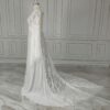 Side profile of off-white lace bridal gown with sweeping train
