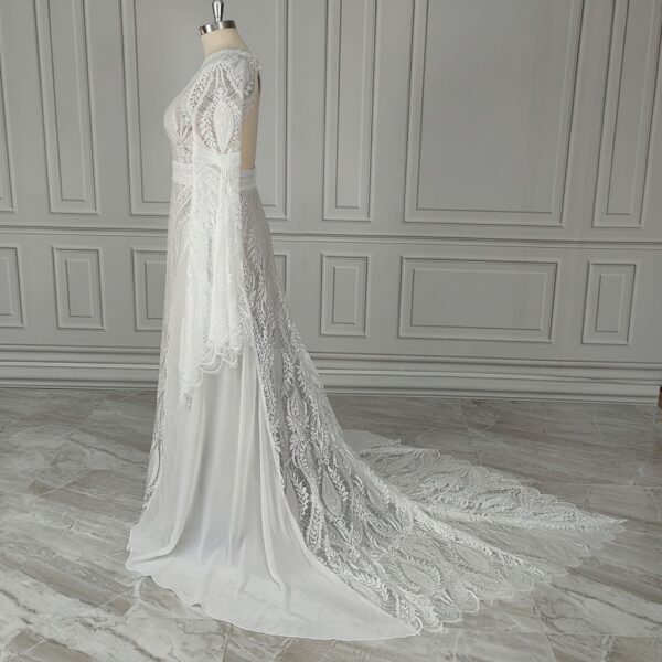 Side profile of off-white lace bridal gown with sweeping train