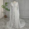 Full front view of off-white lace wedding dress with long sleeves
