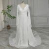 Front view of off-white lace long-sleeve bridal dress