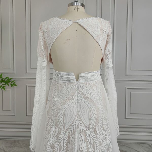 Open keyhole back and long lace sleeves on off-white bridal dress