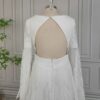 Rear bodice detail of off-white keyhole-back wedding dress