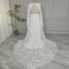 Full rear view of off-white open-back lace gown and train