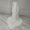 Rear studio view of off-white lace wedding gown and patterned train
