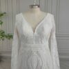 Close view of off-white V-neck lace bodice and defined waist