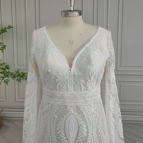 Close view of off-white V-neck lace bodice and defined waist